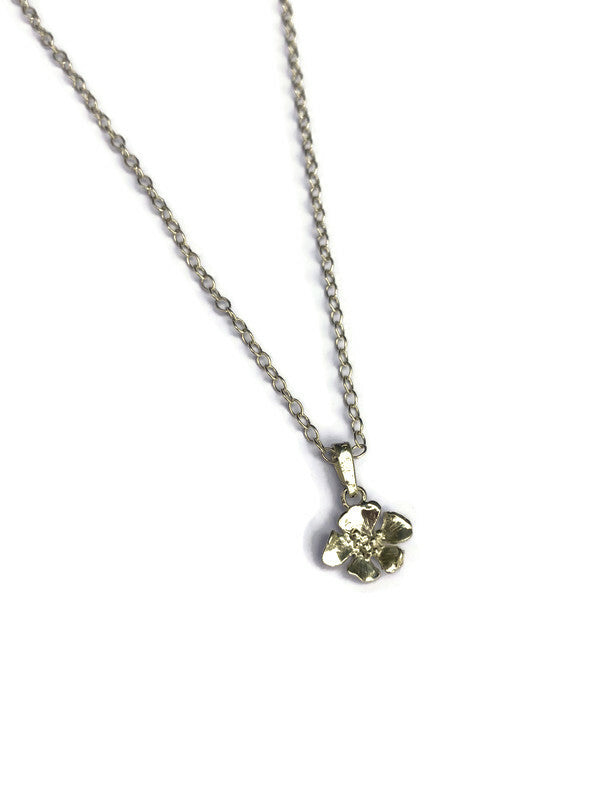 pretty single flower pendant and chain on white background