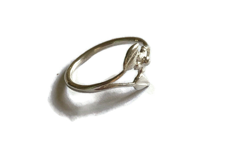 split shank floral silver ring on white background
