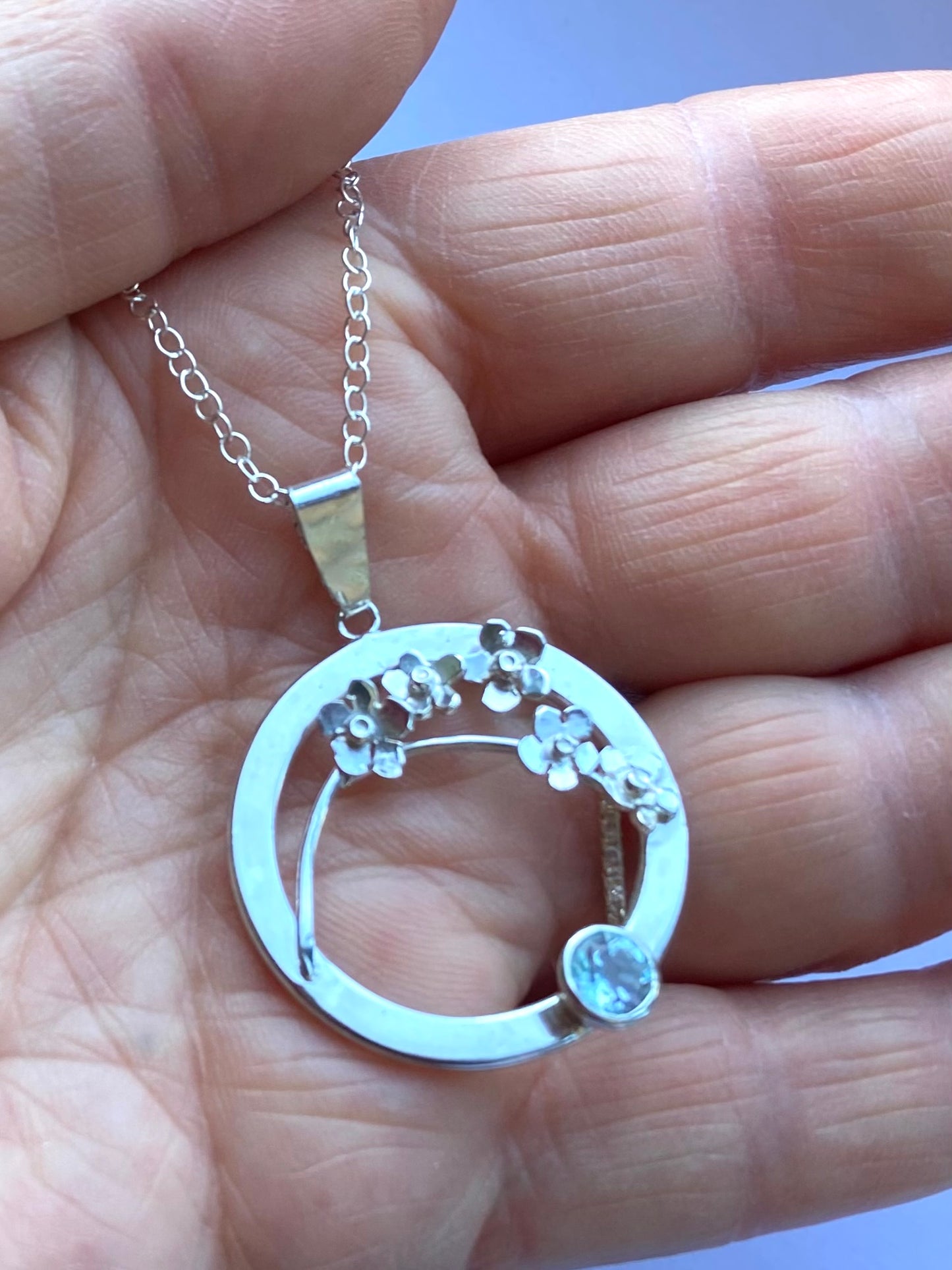 Forget-me-Not floral pendant set with blue topaz