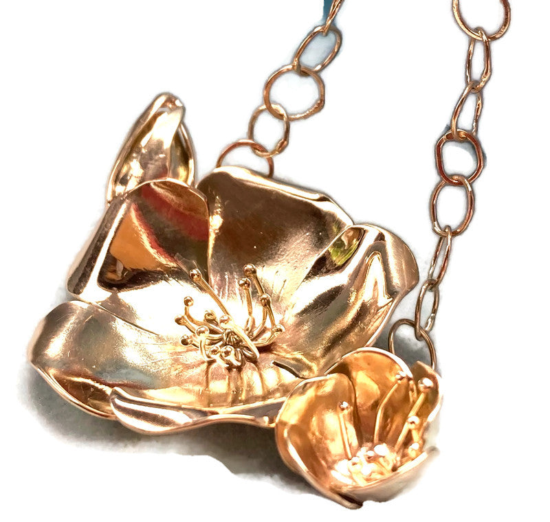 large 9ct gold flower necklace, hand forged by Kim-Styles-Jewellery, on white background