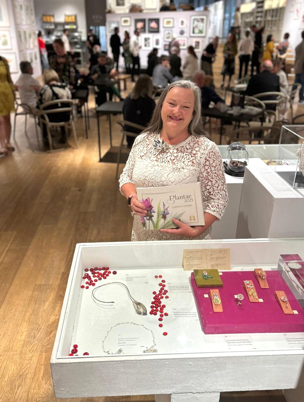 Kim Styles on show at Plantae 25 in Mall Galleries London with cala lily hand forged sterling silver necklace