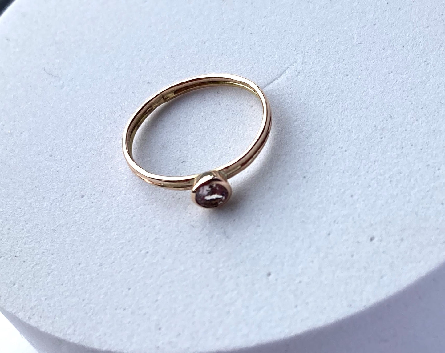 handmade pale pink gemstone solitaire gold ring on white background