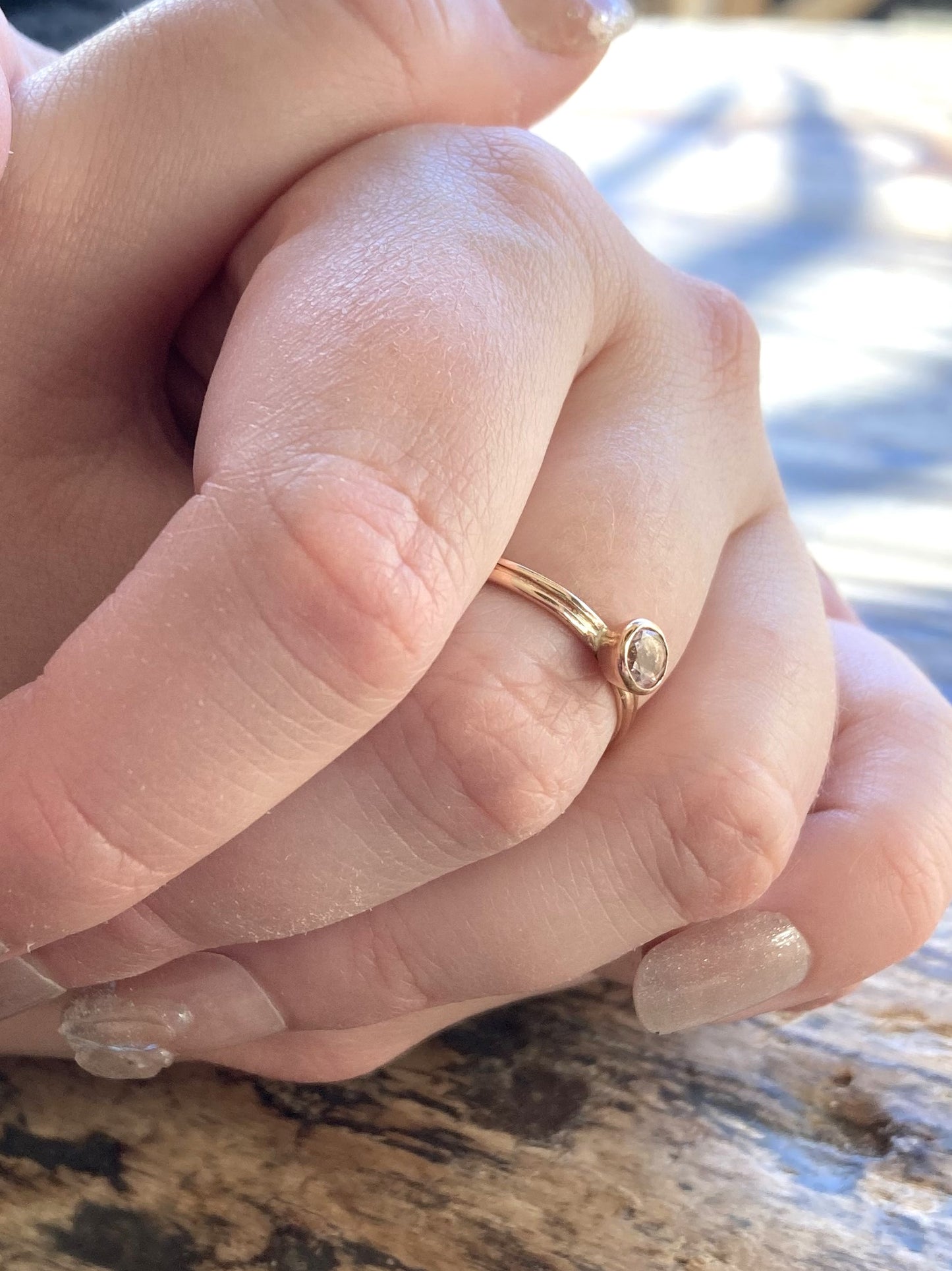 rose gold twin shank ring set with pale pink morganite, on ladies hand
