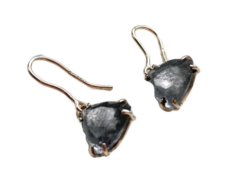 hallmarked gold hook earrings set with triangle rutilated quartz, on white background