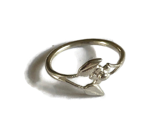 silver flower and leaf ring on white background