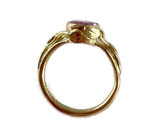 side view gold ring with leaf and twig details, on white background
