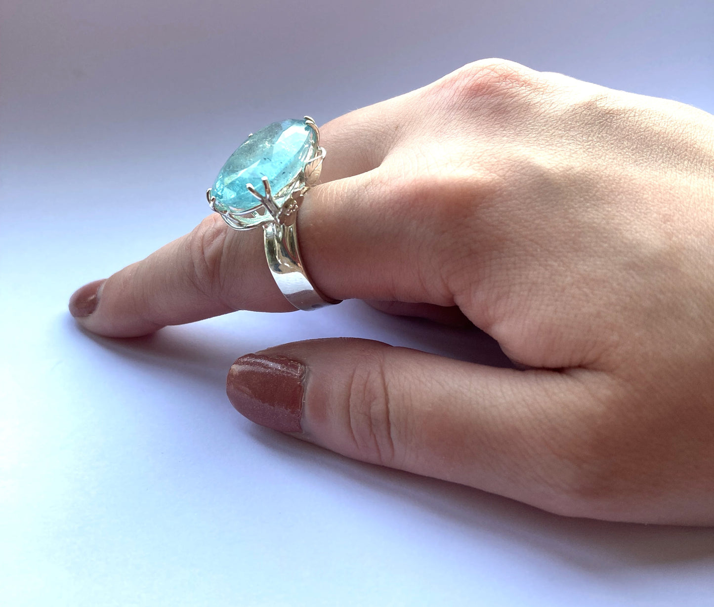 light blue aquamarine floral statement ring on hand