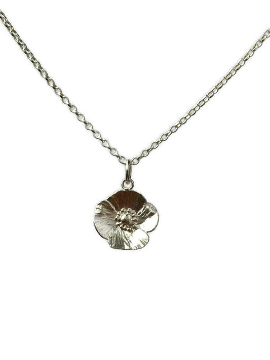 hammer texture silver poppy pendant on white background