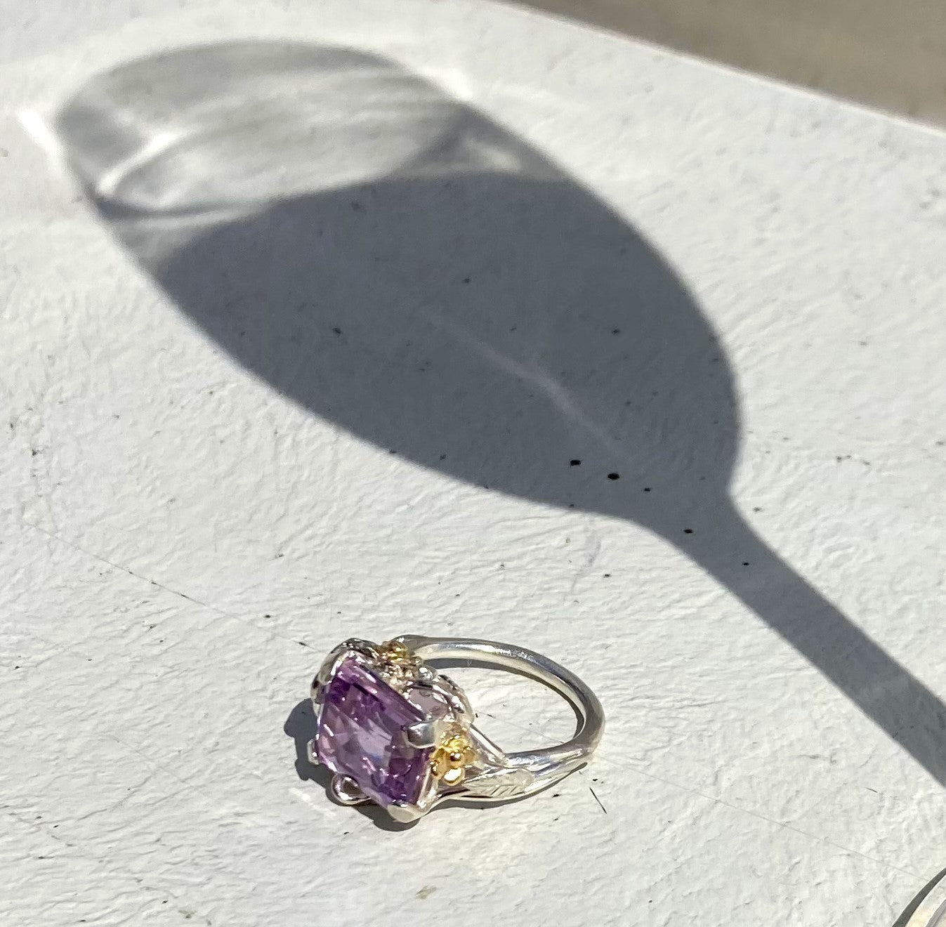 shadow of wine glass and fancy amethyst cocktail ring