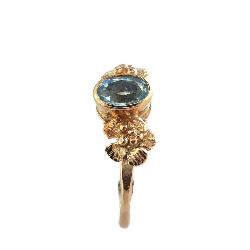 Gold blue topaz floral solitaire ring