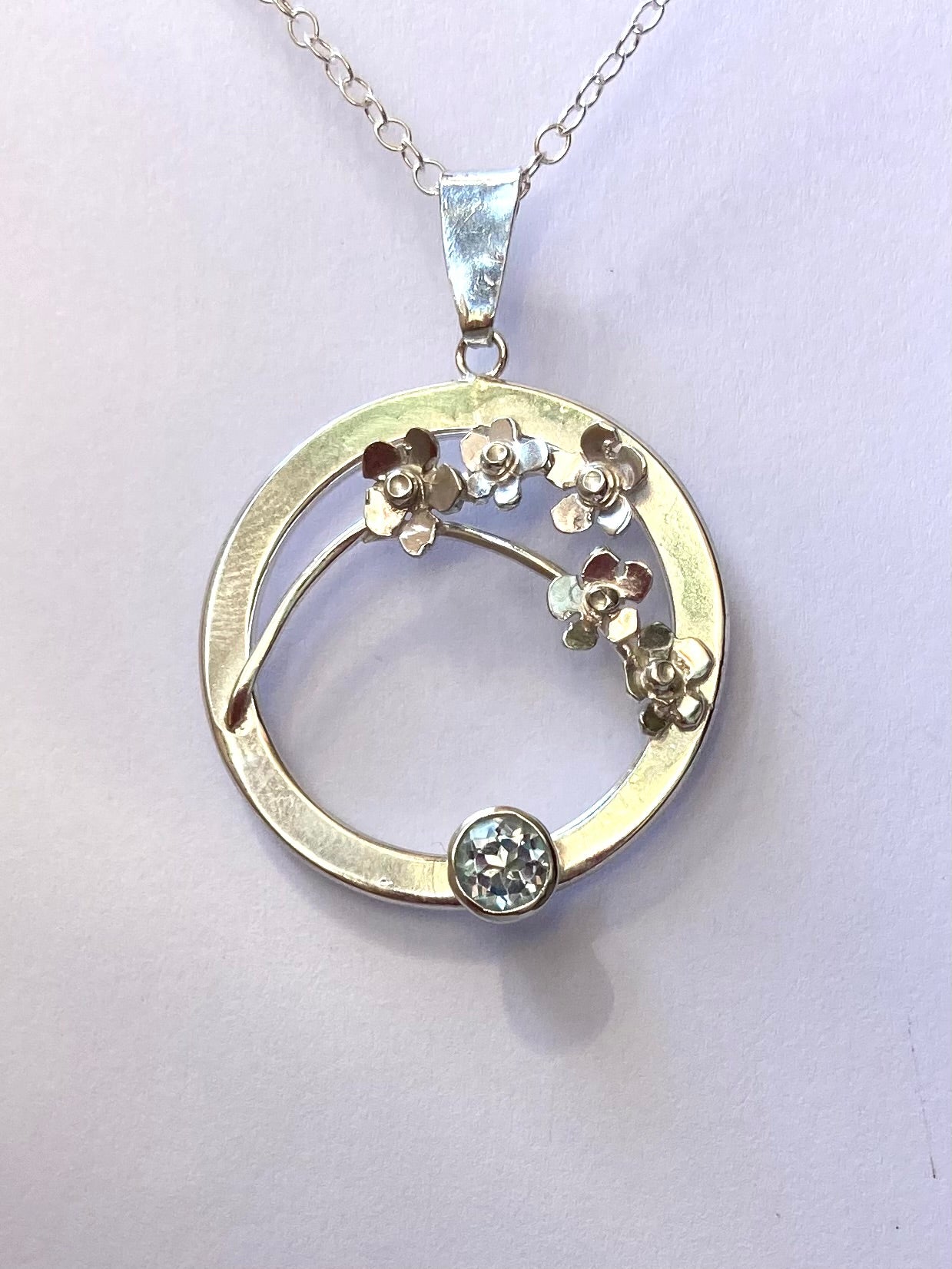 Forget-me-Not floral pendant set with blue topaz