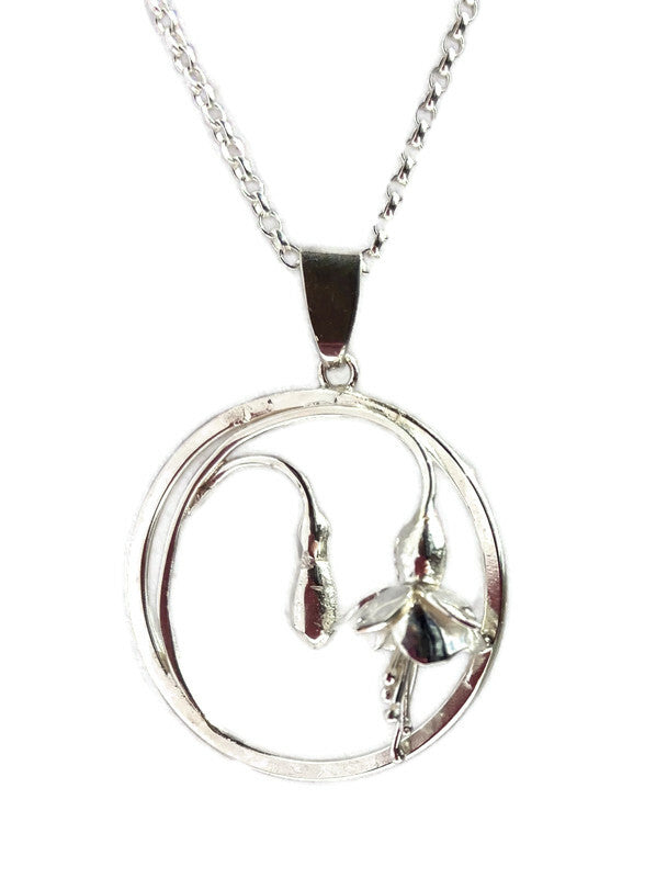 circle pendant with fuchsia flowers