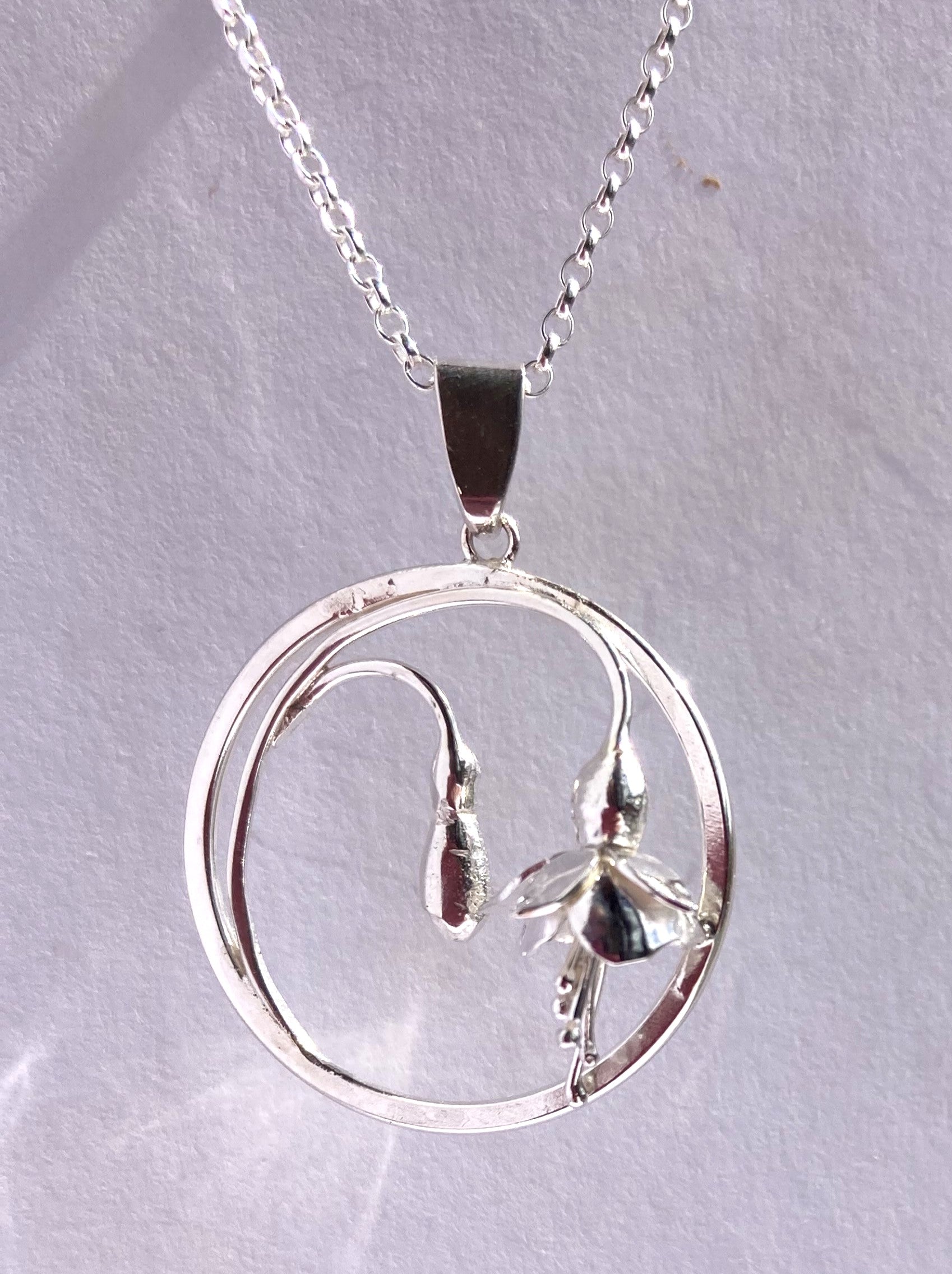 silver botanical floral pendant with fuchsia flowers