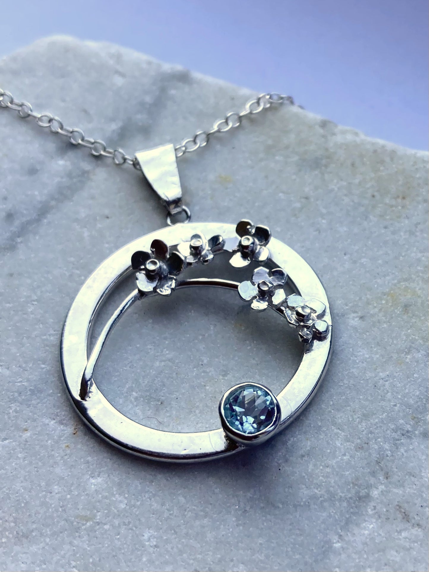 Forget-me-Not floral pendant set with blue topaz
