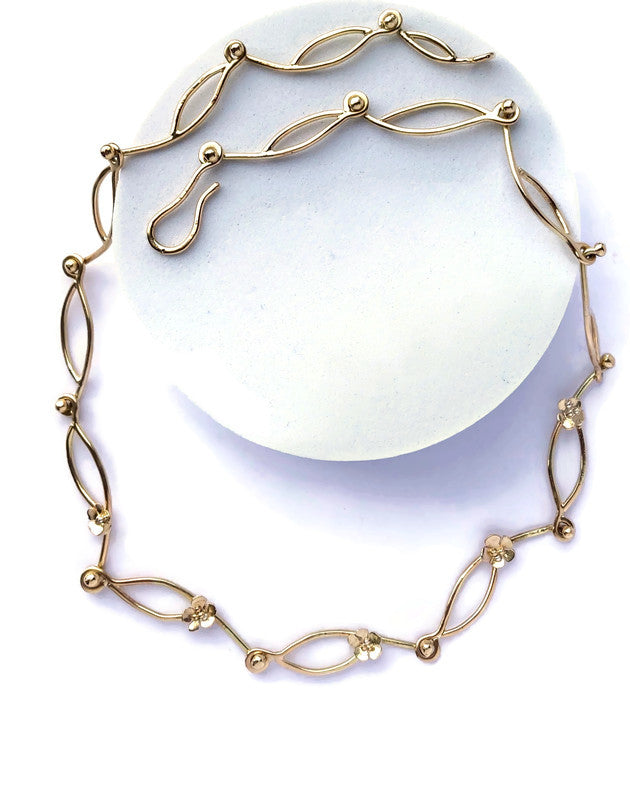 handmade chunky gold chain with small flowers, on white background