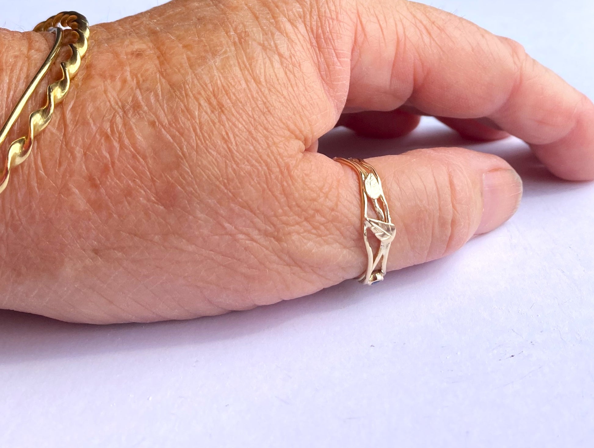 gold leaf ring on hand