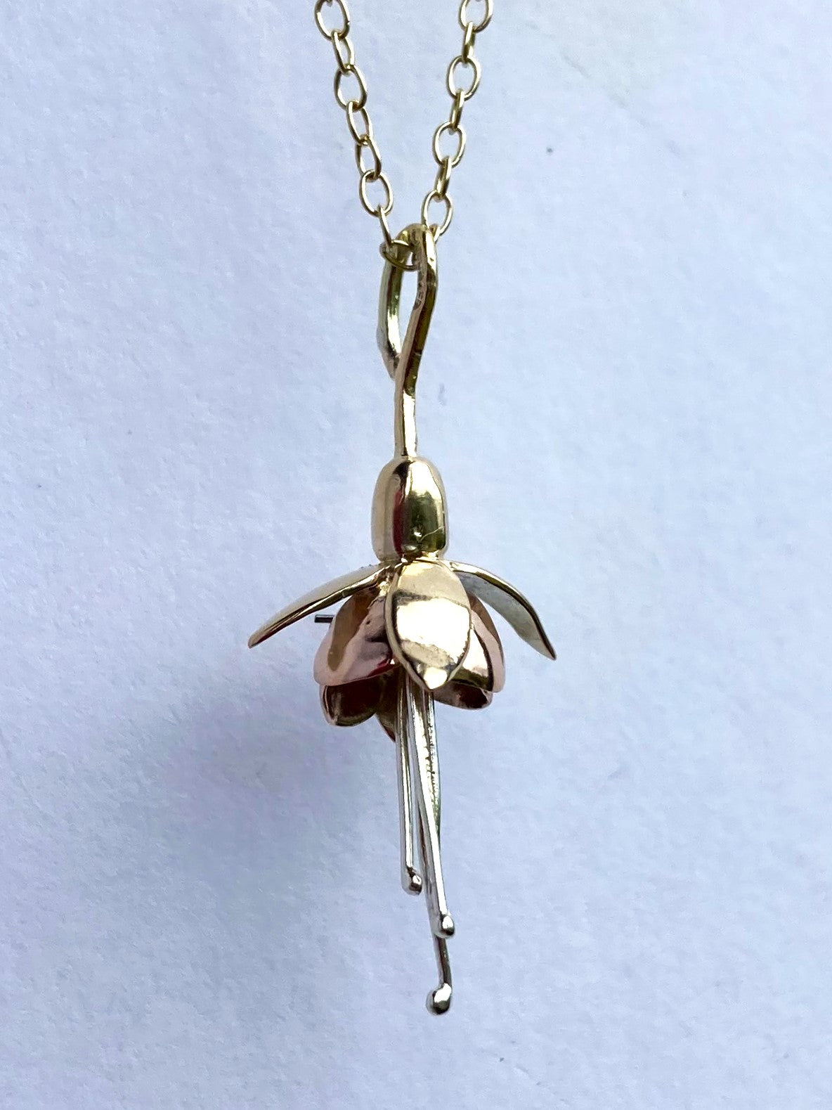 Floral Fuchsia pendant in three colour gold