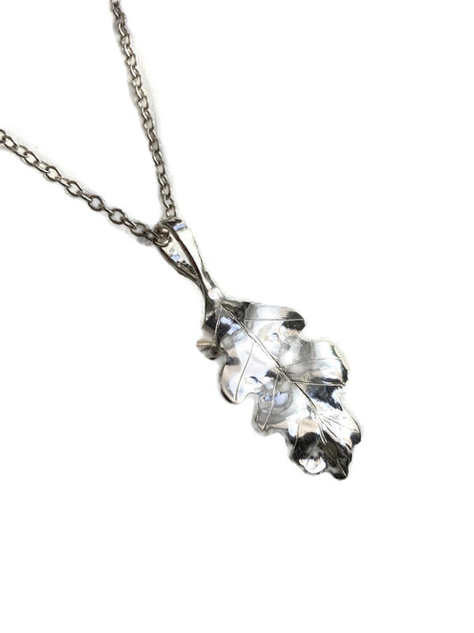 A silver oak leaf pendant necklace by Kim Styles Jewellery, on a matching silver chain, photographed against a solid white background.