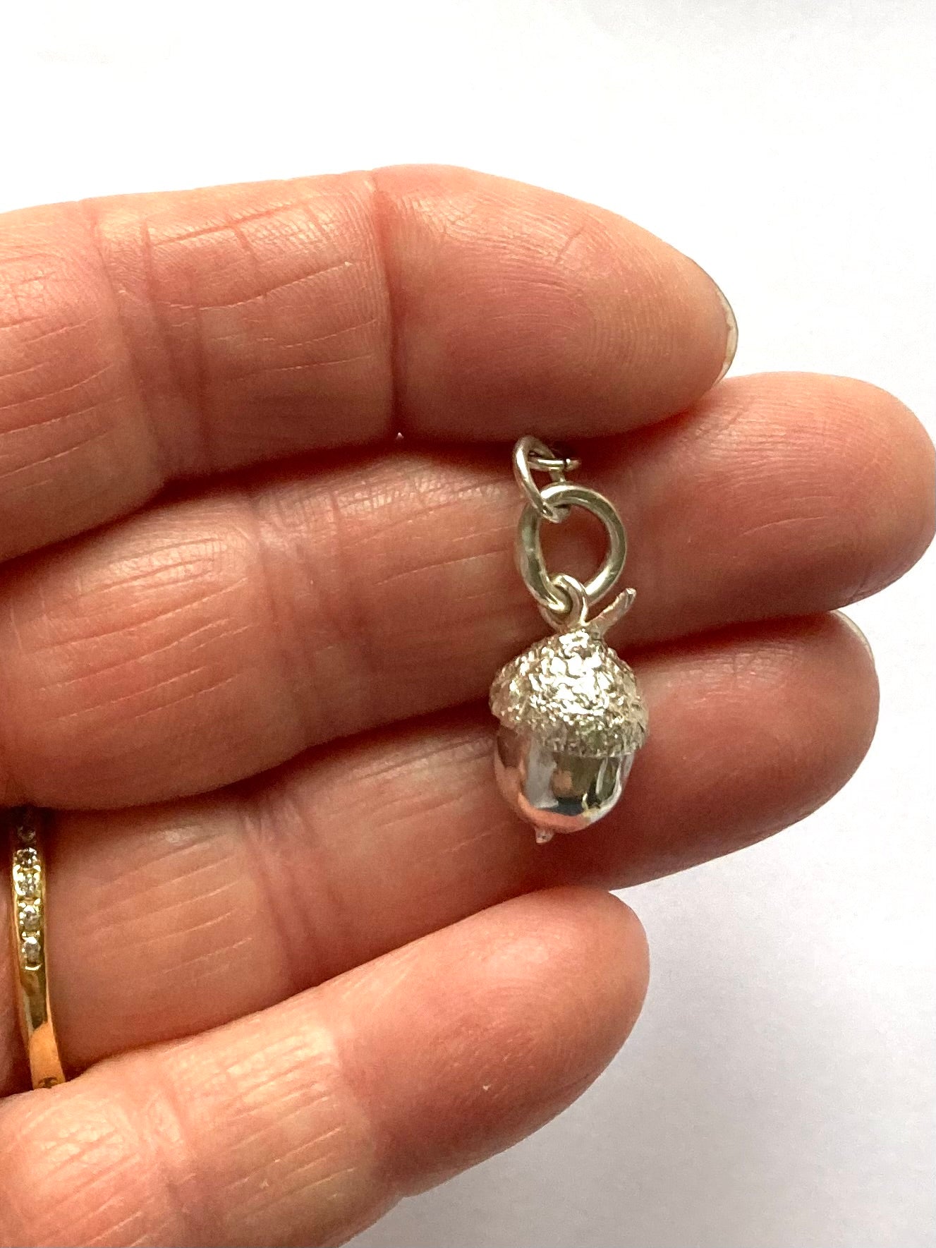 Tiny botanical acorn pendant by Kim Styles Jewellery in sterling silver 