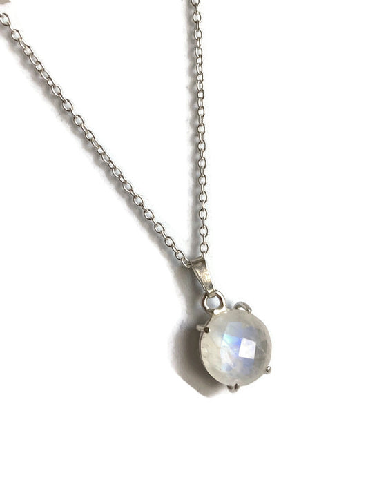 Kim Styles necklace with a round chequerboard moonstone pendant on a white background