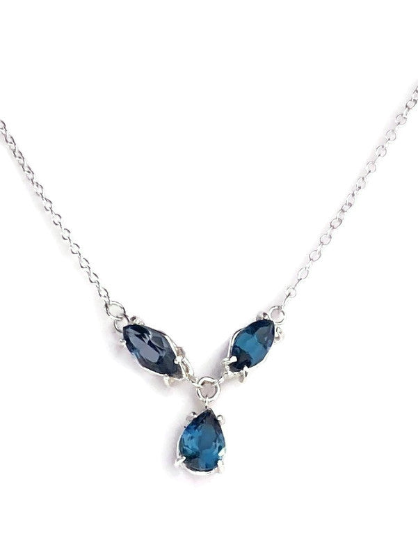 Necklace with blue teardrop-shaped gemstones on a white background