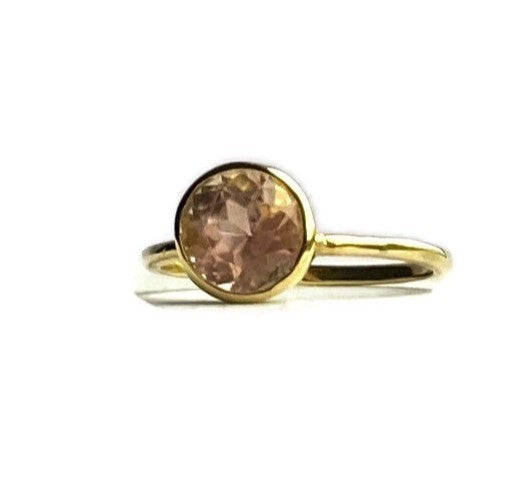 18ct Gold solitaire ring with a pale pink gemstone on a white background by Kim Styles Jewellery