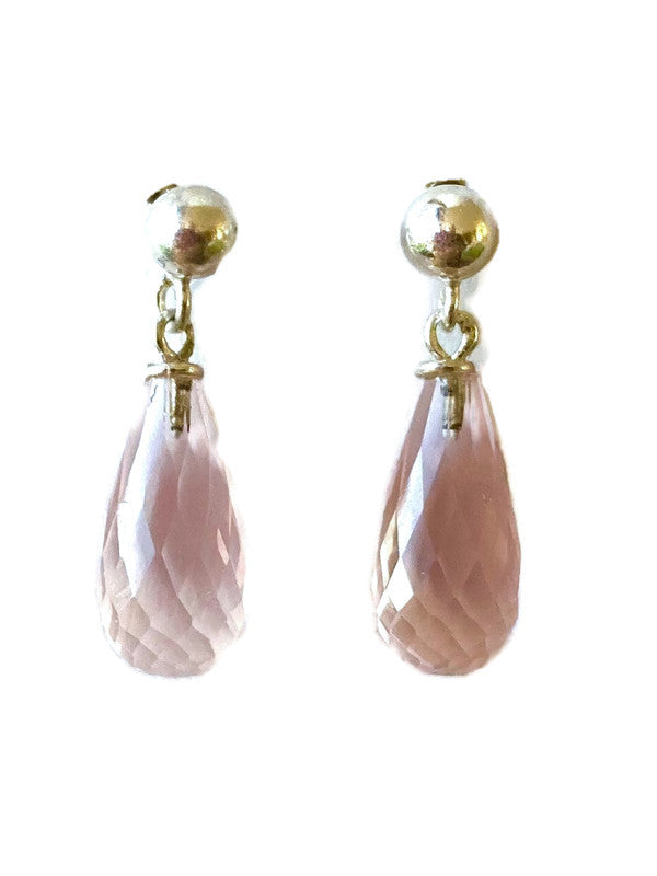 Pair of pink rose quartz teardrop earrings with silver studs on a white background