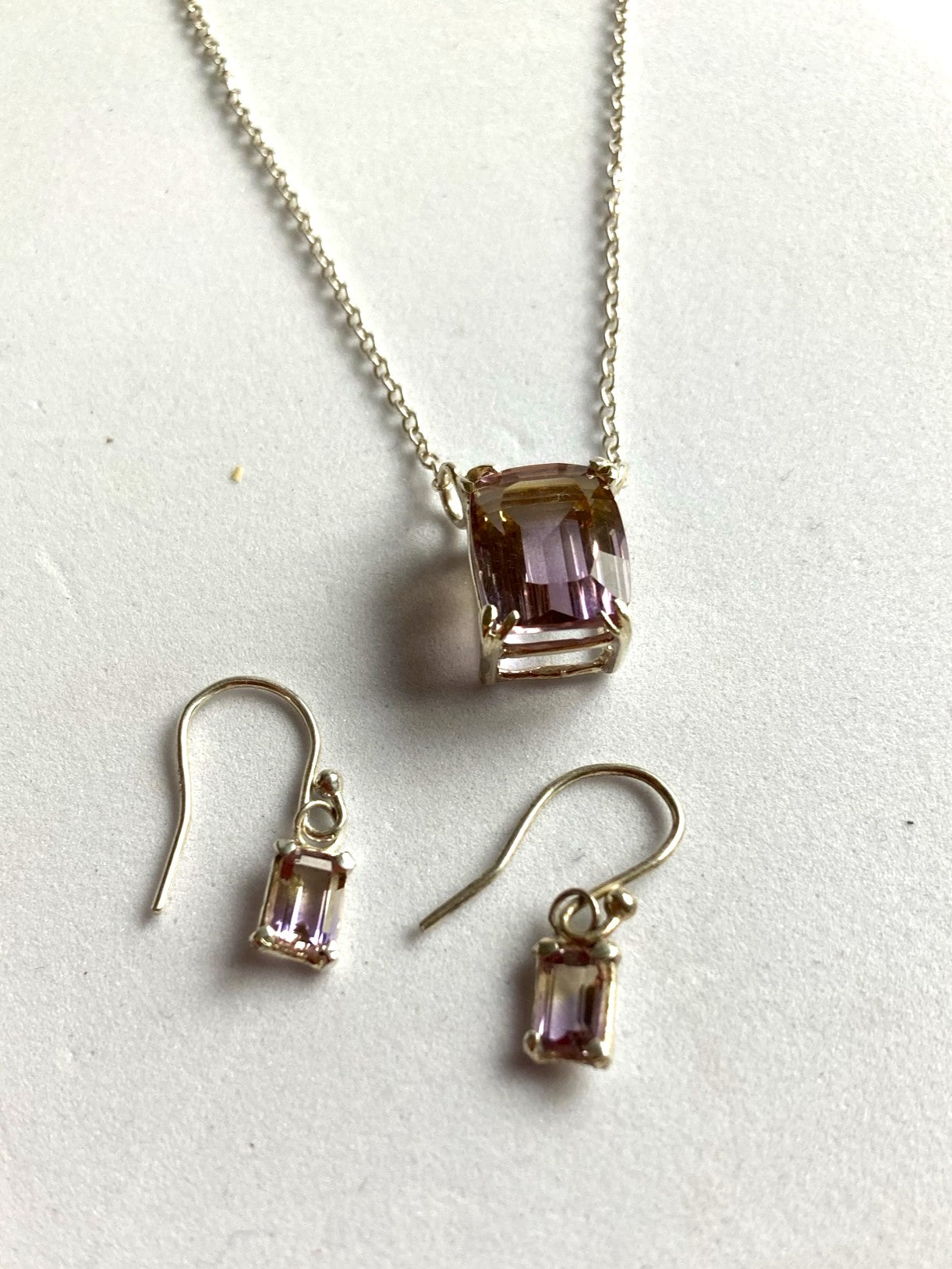 Kim Styles jewellery set with necklace and earrings featuring purple ametrine gemstones on a white background