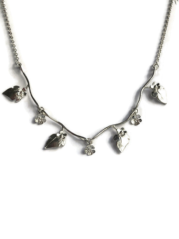 Silver floral necklace by Kim Styles Jewellery, on a white background