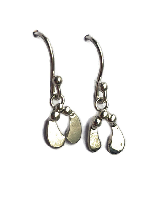 A pair of silver mistletoe theme dangle earrings by Kim Styles Jewellery, shown against a plain white background.