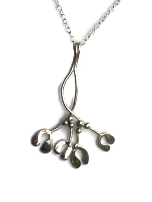 A sterling silver mistletoe pendant necklace by Kim Styles Jewellery,  on a delicate chain, set against a plain white background.