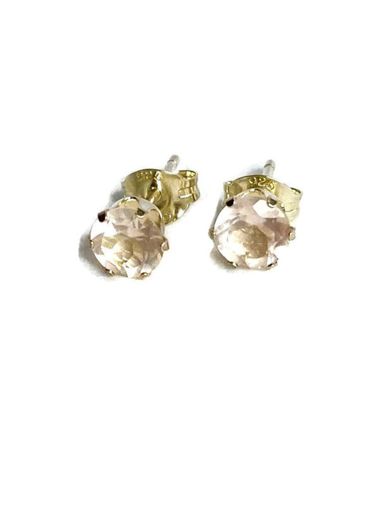 Silver stud  earrings with pale pink rose quartz gemstones on a white background
