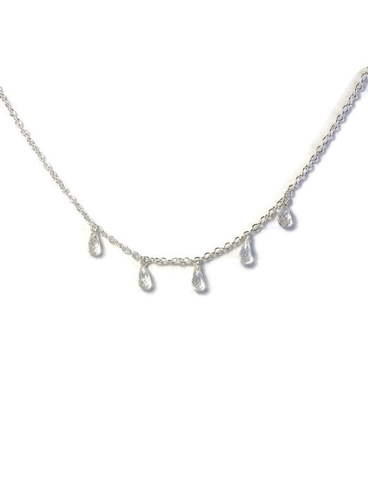 Kim Styles silver necklace with teardrop-shaped white topaz pendants on a white background