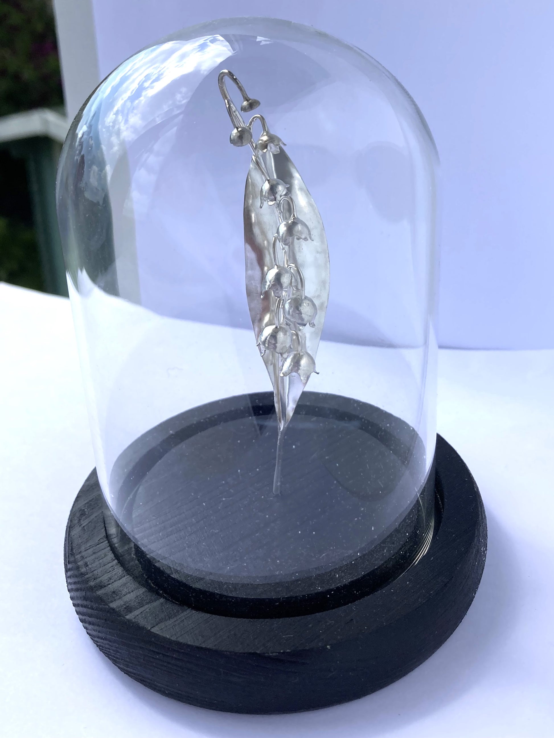 silver lily of the valley sculpture in glass dome