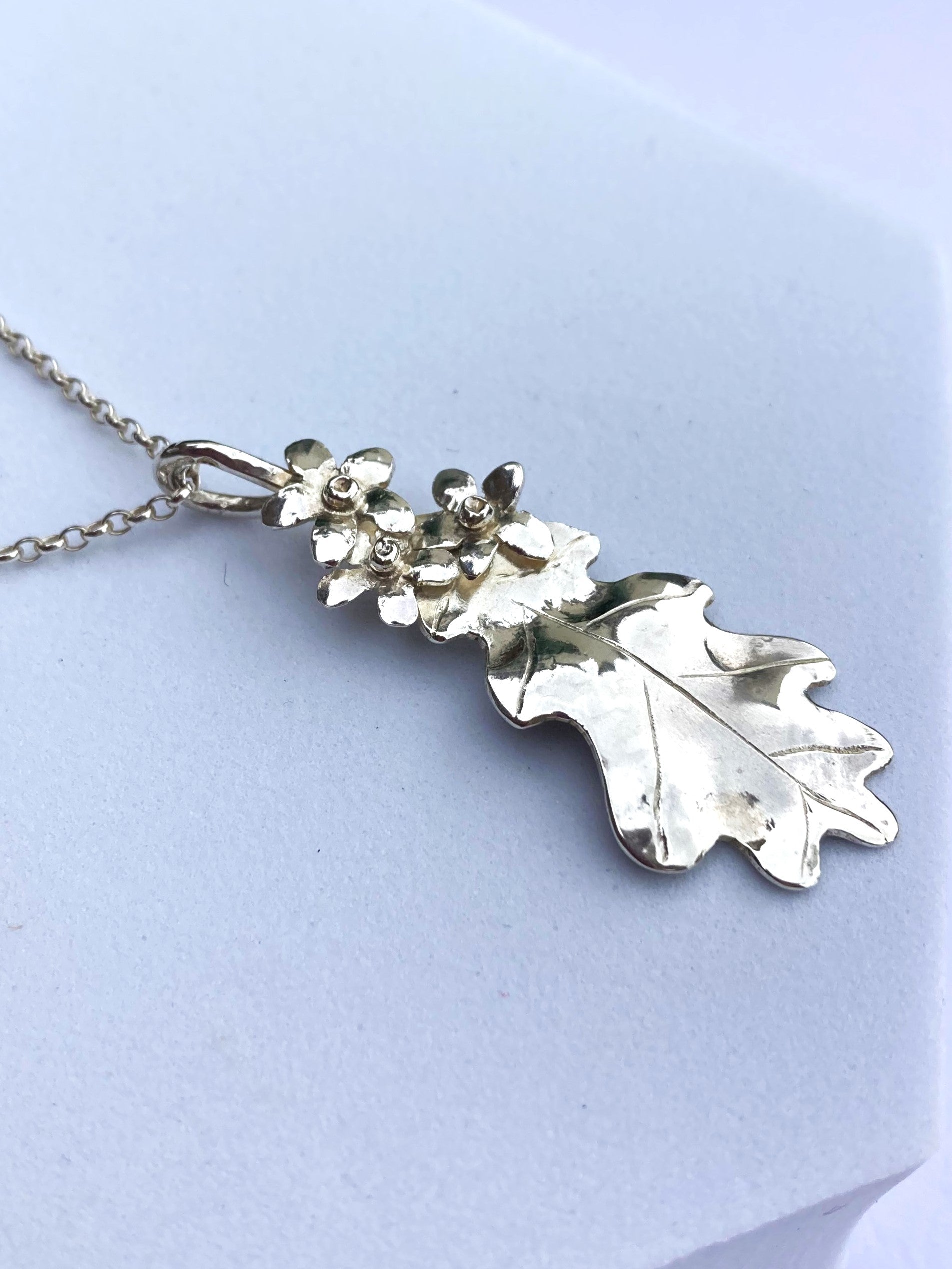 handmade silver oak leaf  with small flowers by Kim Styles Jewellery