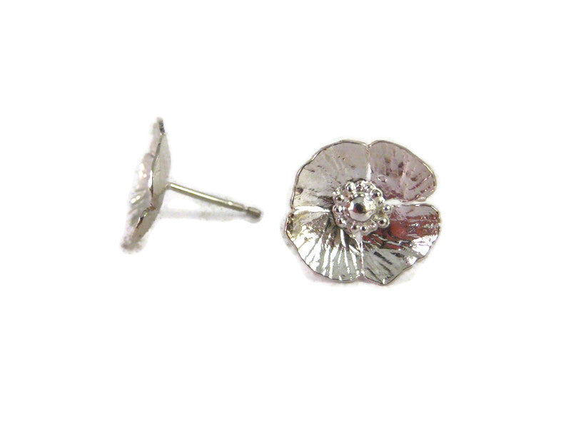 Poppy stud earrings with hammered texture, on white background