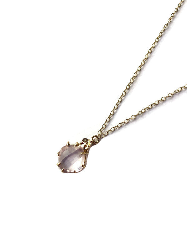 cushion shape pink rose quartz and gold pendant, on white background