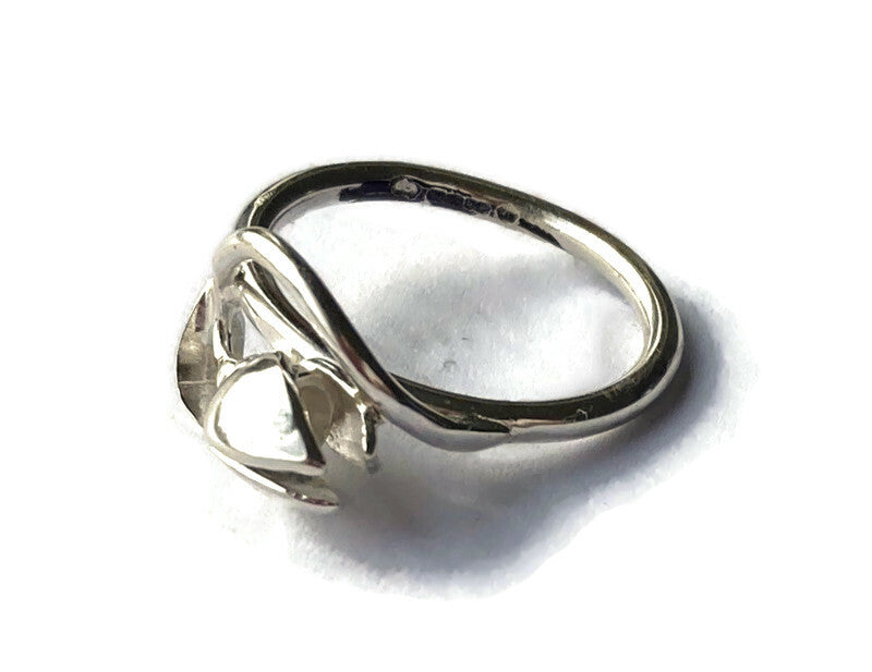 curving snowdrop ring by Kim Styles Jewellery, on white background