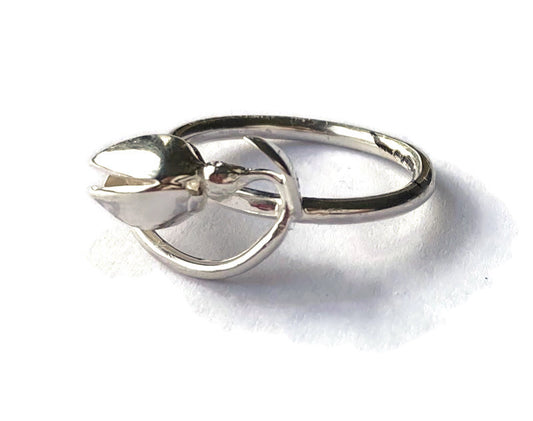 art nouveau style curving silver snowdrop ring, on white background