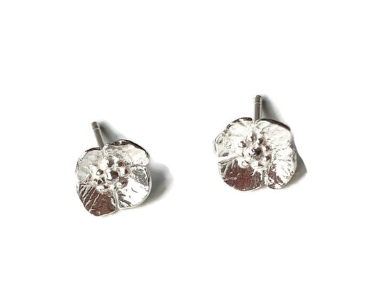 small poppy floral stud earrings on white background