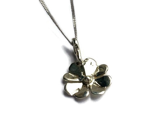 white gold four leaf cover pendant on white background