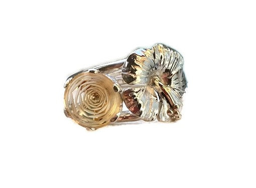 silver cocktail ring with unusual cut yellow citrine that looks like a rose, and a hammered silver hibiscus flower