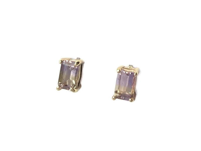 purple and yellow gemstone emerald cut gold stud earrings on white background
