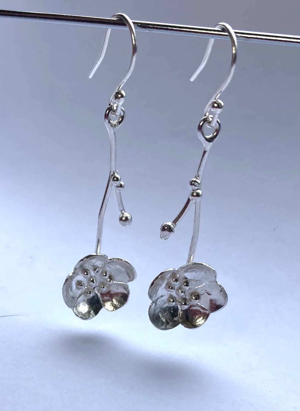 hanging sakura cherry blossom handmade dangly earrings, on grey background