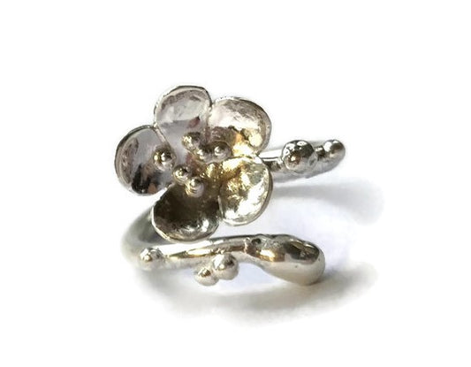 sakura cherry blossom hand forged wrap around ring, on white background