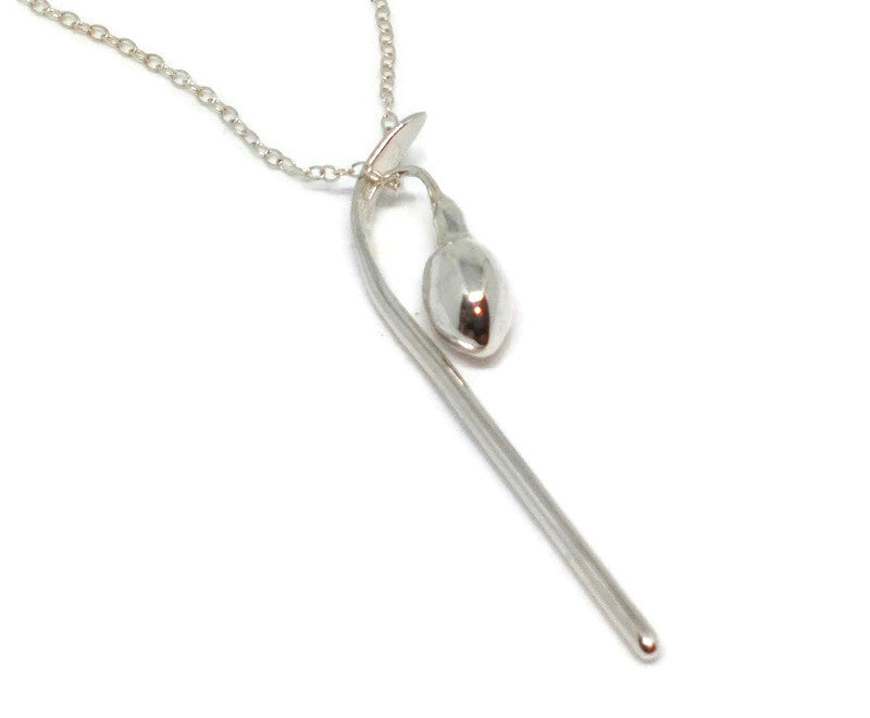 snowdrop bud pendant hand made in sterling silver, on white background